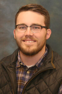 Headshot of Austin Patzel smiling at camera