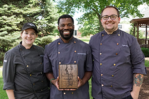 Three people of the CCC hospitality management and culinary arts (HMRM) program receive the Community Partnership Award from the Family and Consumer Sciences Teachers of Nebraska.