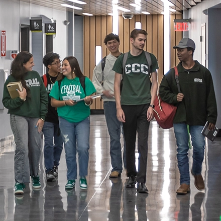 Group of CCC students walk down a hallway