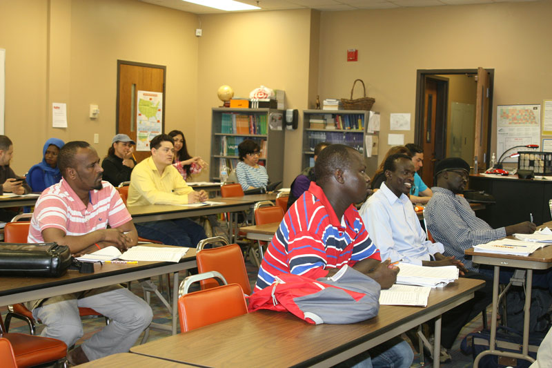 A student in the front row listens to instructions from ESL teacher.