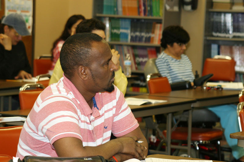 Man sitting at desk in ESL class