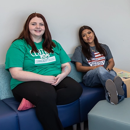 Two girls relaxing on a couch