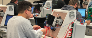 Student working on electronics while sitting at CCC desk