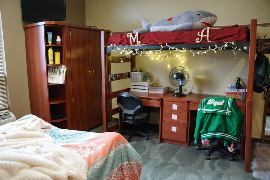 Desk and wardrobe displayed in a Columbus Campus dorm room.