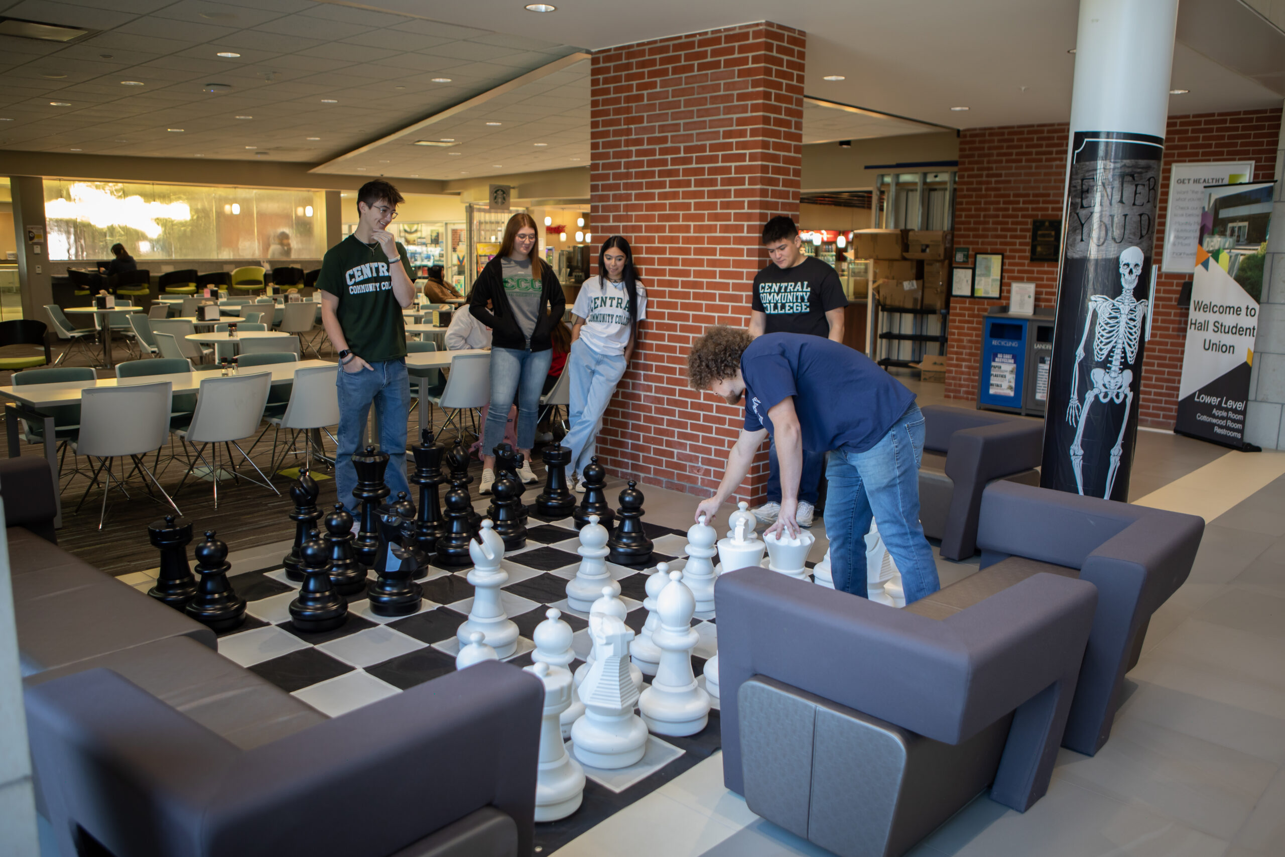 Students playing chess in the residence hall.