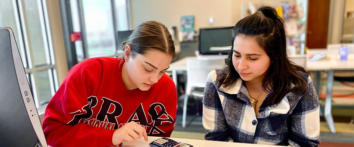 Tutor helps a student in the Academic Success Center on the Kearney campus