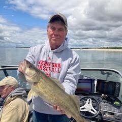 Gene Friesen posing with large fish