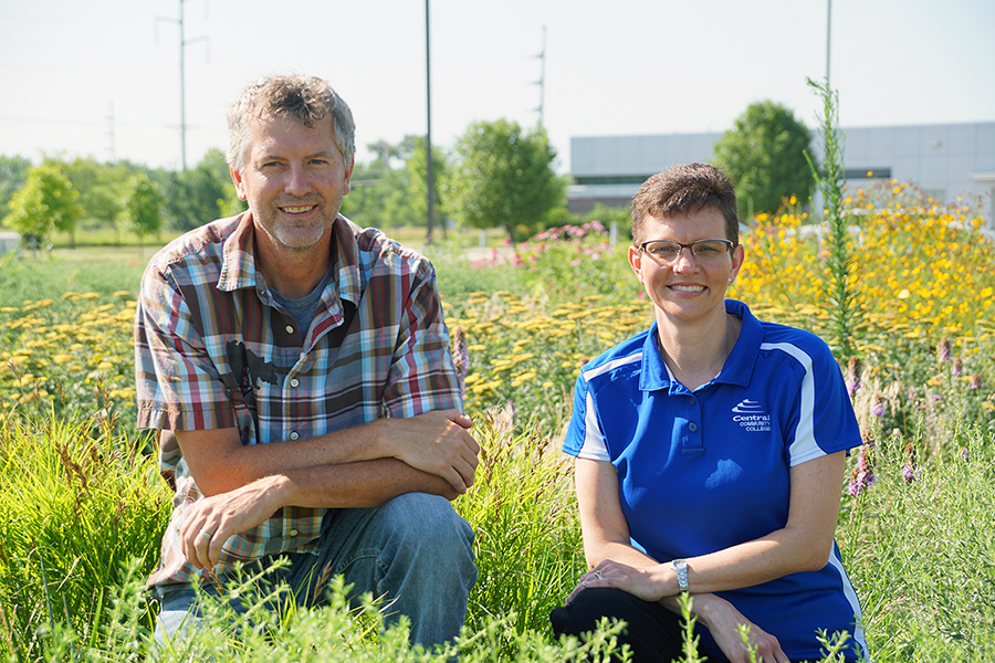 Ben Newton and Dr. Marcie Kemnitz in Grand Island pollinator garden.